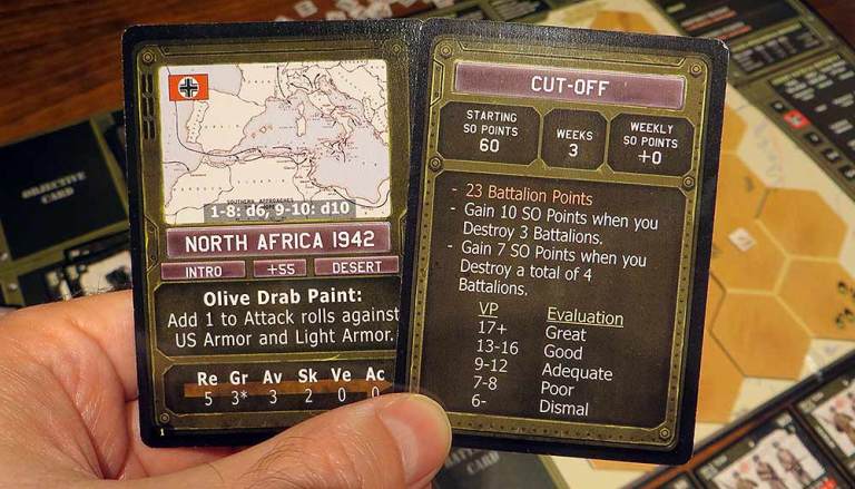 Cartas de campaña (izq) y de objetivo (der), con las reglas especiales para esta partida,